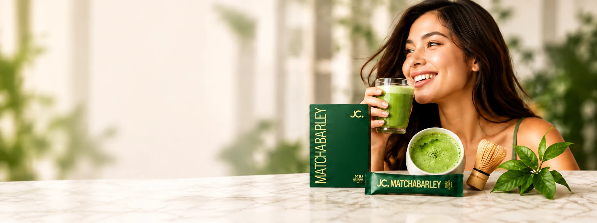 JC Matcha Barley with a glass of matcha and a woman enjoying her wellness routine